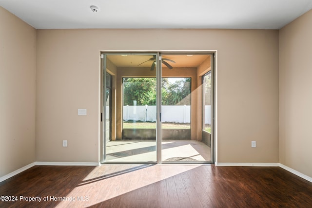 doorway to outside featuring hardwood / wood-style flooring and ceiling fan