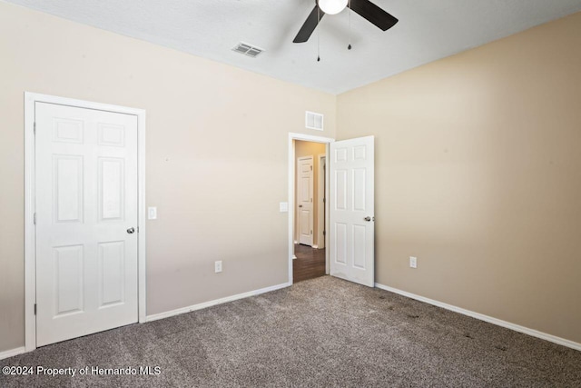 unfurnished bedroom featuring carpet flooring and ceiling fan