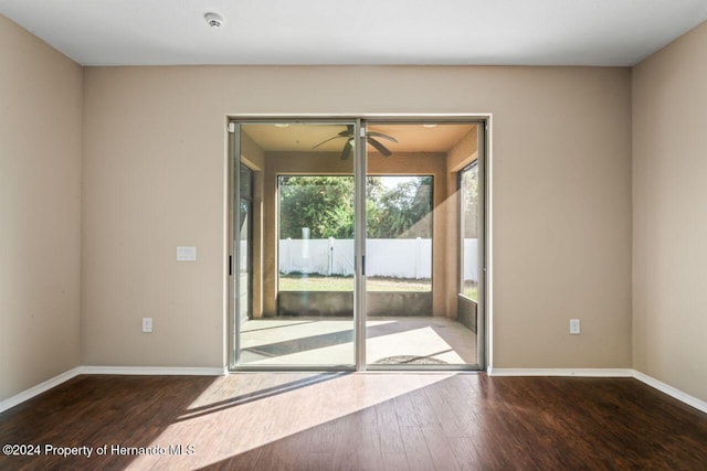 doorway to outside with hardwood / wood-style flooring and ceiling fan