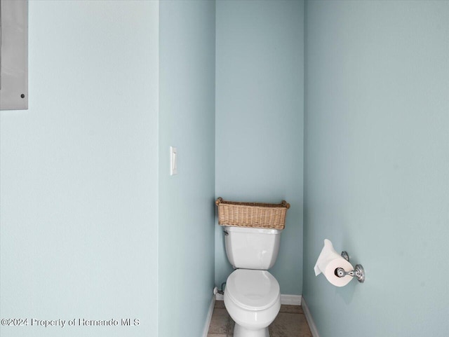 bathroom with tile patterned flooring and toilet