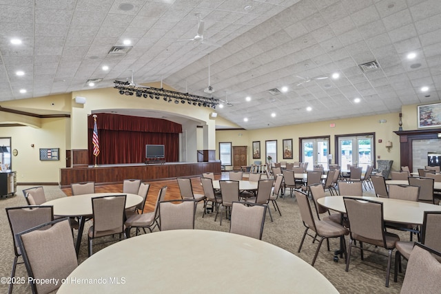 dining area featuring ceiling fan and vaulted ceiling