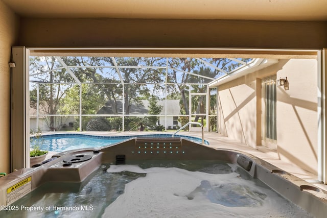 view of swimming pool with glass enclosure