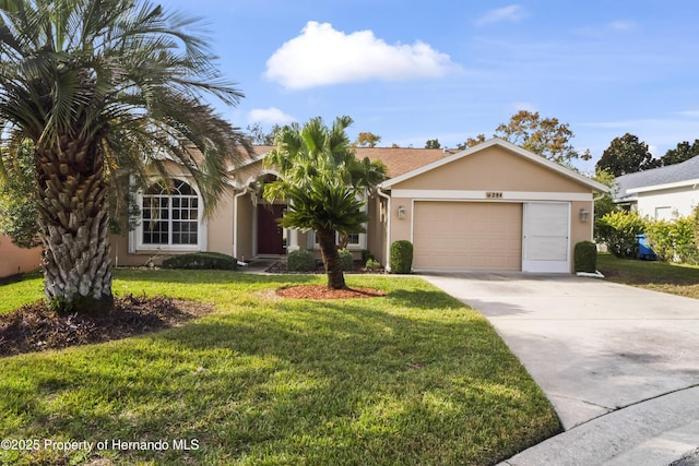 single story home with a front yard and a garage