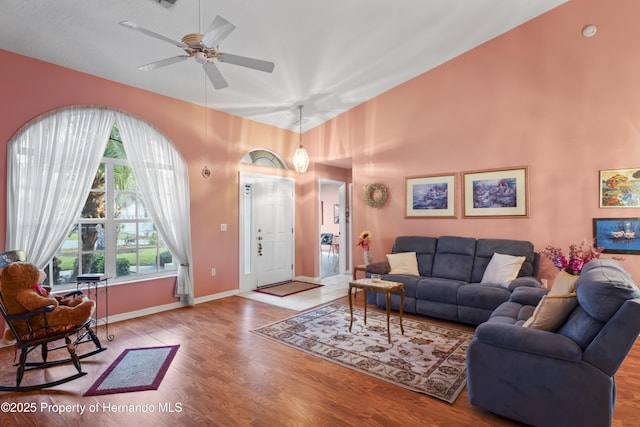 living room featuring ceiling fan and light wood-type flooring