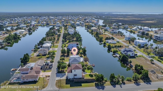 drone / aerial view with a water view