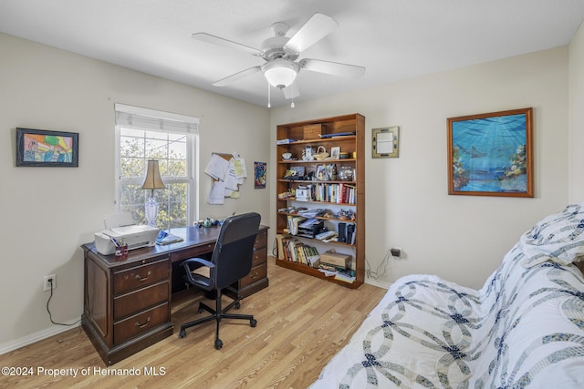 office area with light wood-type flooring and ceiling fan