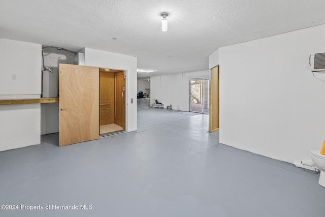 basement featuring a textured ceiling