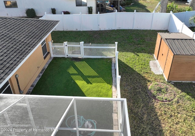 view of yard with a storage unit