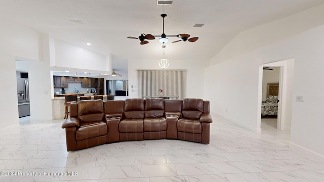 living room featuring ceiling fan and high vaulted ceiling