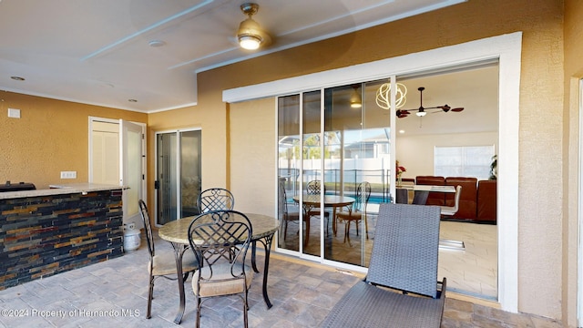 view of patio / terrace featuring ceiling fan