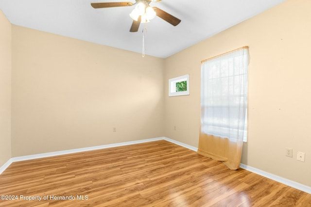 unfurnished room with ceiling fan and light hardwood / wood-style floors