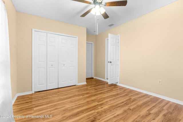 unfurnished bedroom featuring ceiling fan and light hardwood / wood-style flooring