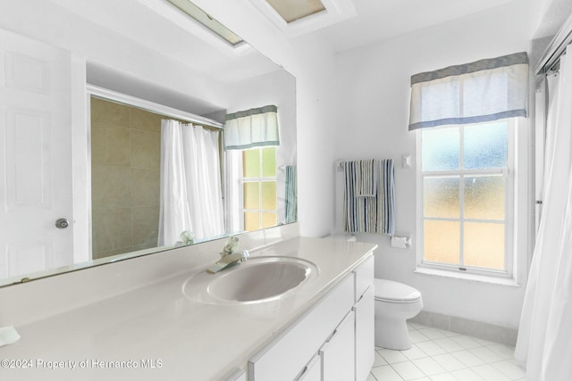 bathroom with tile patterned floors, vanity, toilet, and a shower with shower curtain