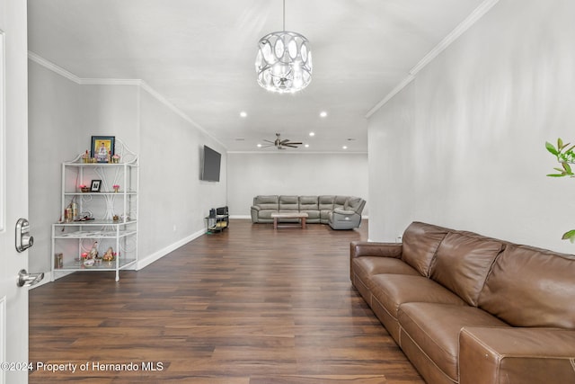 living room featuring ceiling fan with notable chandelier, dark hardwood / wood-style floors, and crown molding