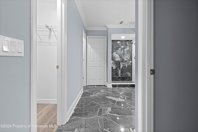 hall with dark hardwood / wood-style flooring and crown molding