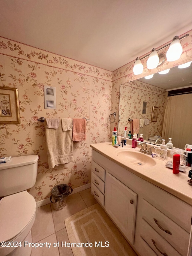 bathroom with walk in shower, tile patterned flooring, vanity, and toilet