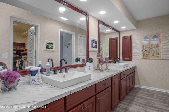 bathroom featuring vanity and wood-type flooring