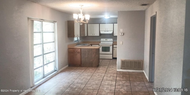 kitchen with sink, an inviting chandelier, white range oven, decorative light fixtures, and white cabinets