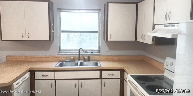 kitchen featuring white cabinetry, sink, white appliances, and ventilation hood