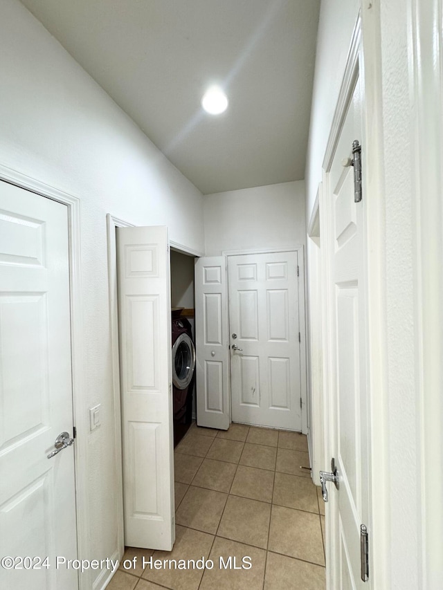 laundry area featuring light tile patterned floors