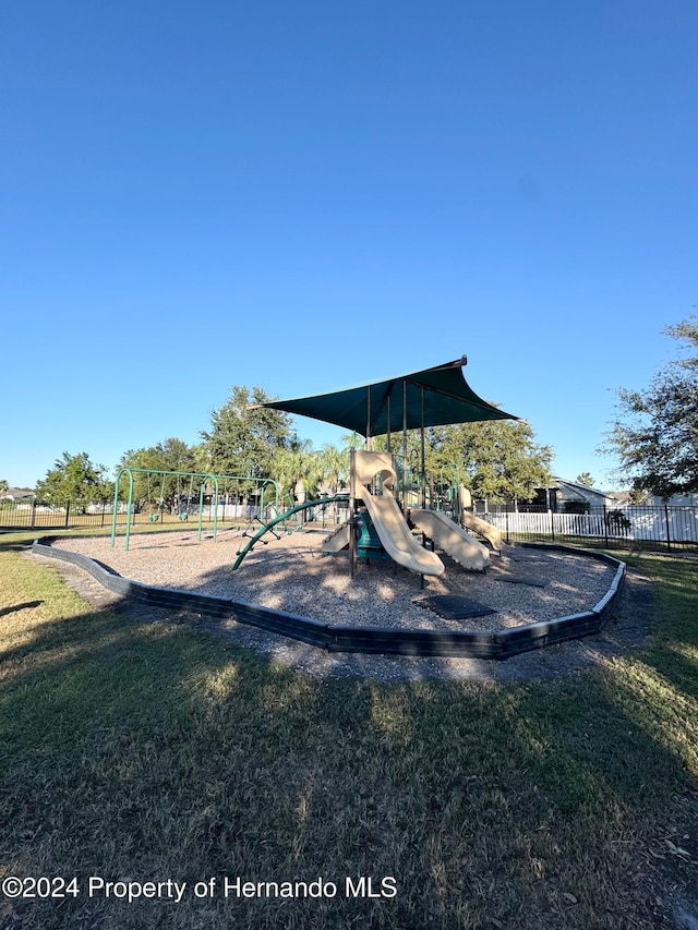 view of playground with a yard