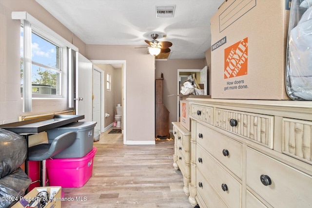 interior space with light hardwood / wood-style flooring and ceiling fan