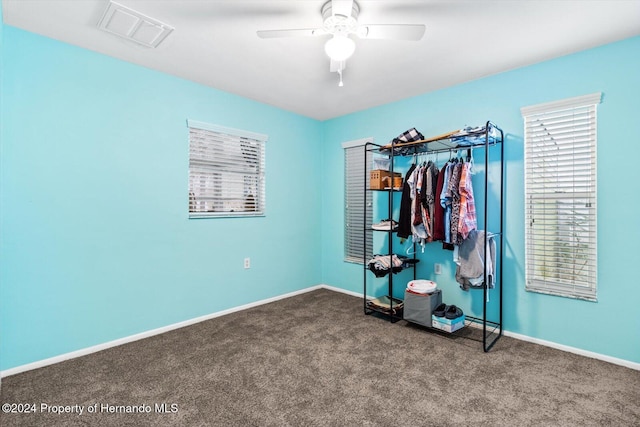 unfurnished bedroom featuring carpet and ceiling fan