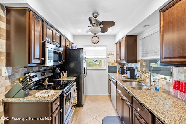 kitchen featuring decorative backsplash, sink, and stainless steel appliances