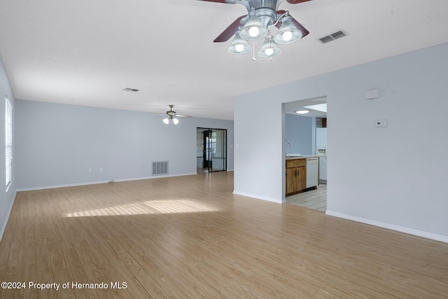 unfurnished living room with ceiling fan and light hardwood / wood-style floors