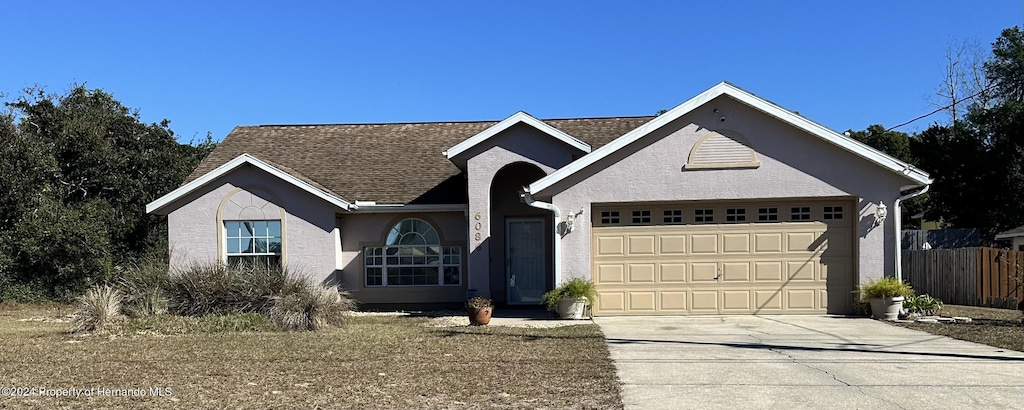 view of front of property featuring a garage