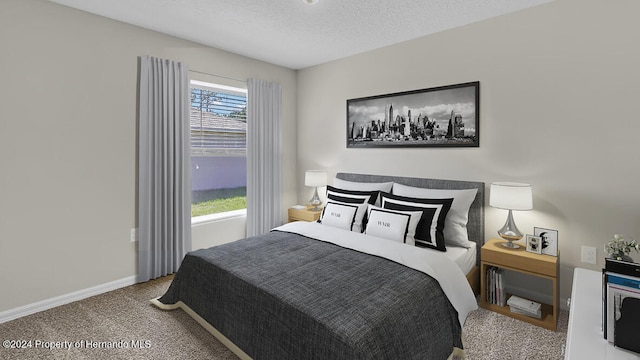 carpeted bedroom featuring a textured ceiling