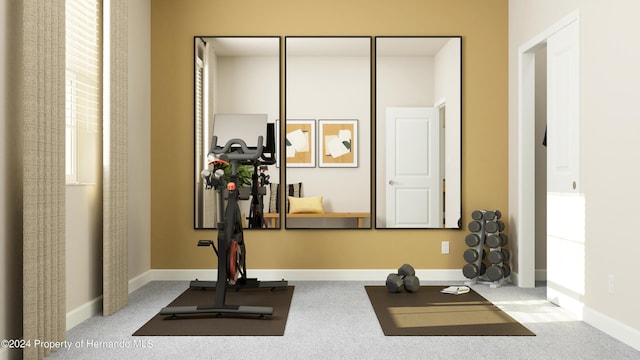 workout area featuring light carpet