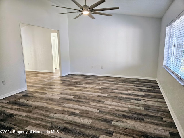 unfurnished room featuring ceiling fan and dark wood-type flooring