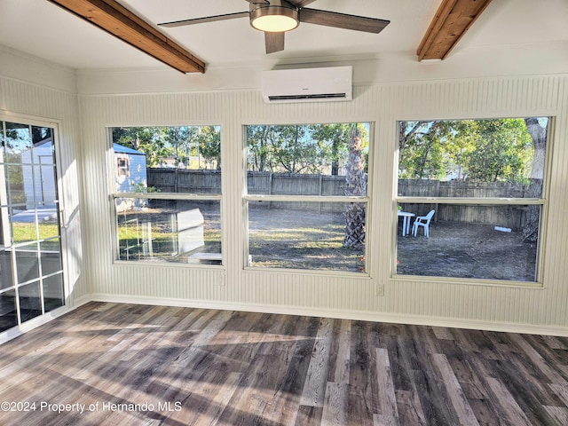 unfurnished sunroom featuring a wall mounted air conditioner, beam ceiling, ceiling fan, and a healthy amount of sunlight