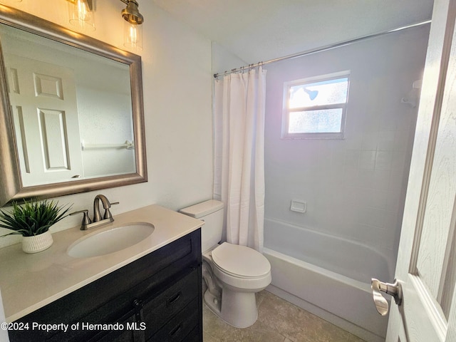 full bathroom with shower / bathtub combination with curtain, tile patterned flooring, vanity, and toilet