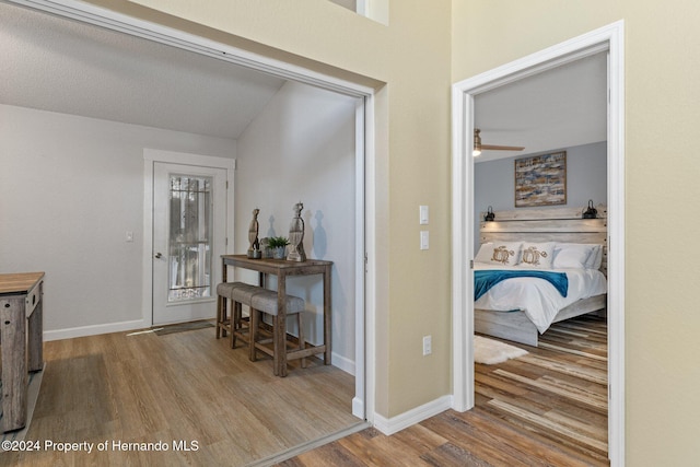 hall with light hardwood / wood-style floors