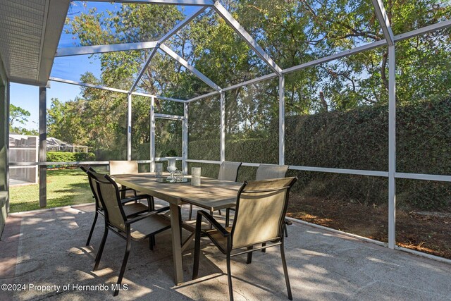 view of patio / terrace with glass enclosure