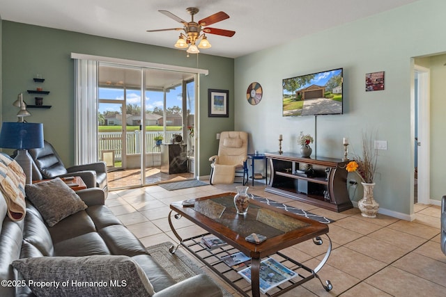 tiled living room with ceiling fan