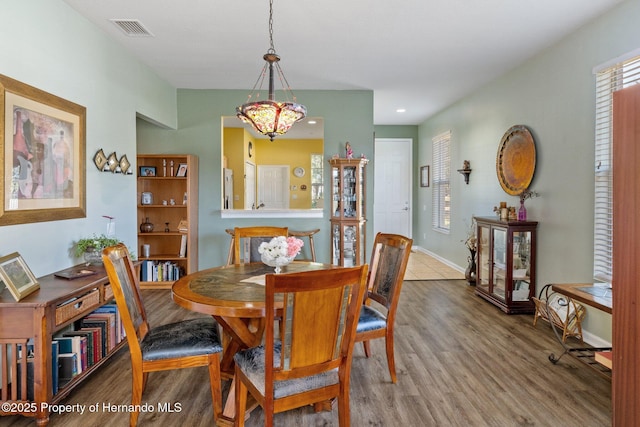 dining area featuring hardwood / wood-style flooring