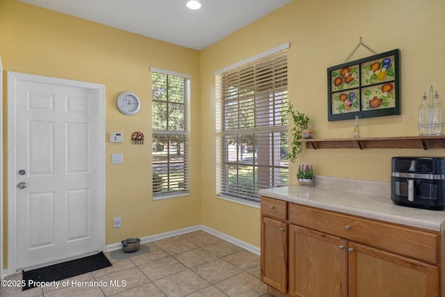 laundry room with light tile patterned flooring