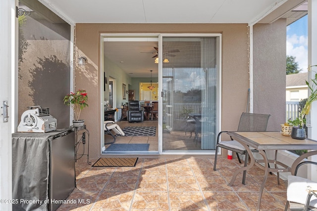 doorway to property with a patio