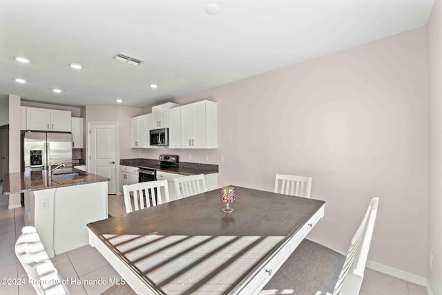 tiled dining area with sink