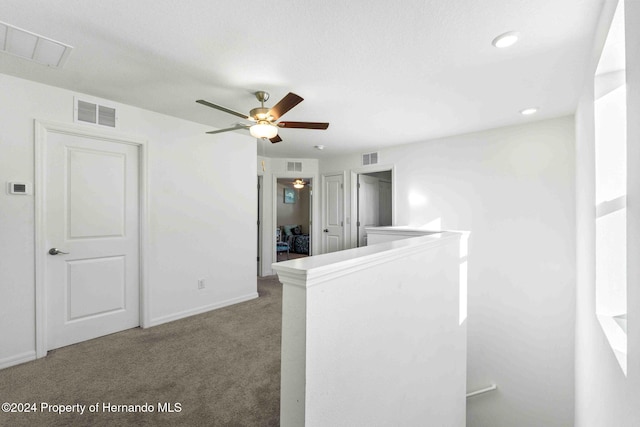 unfurnished room featuring carpet flooring and ceiling fan