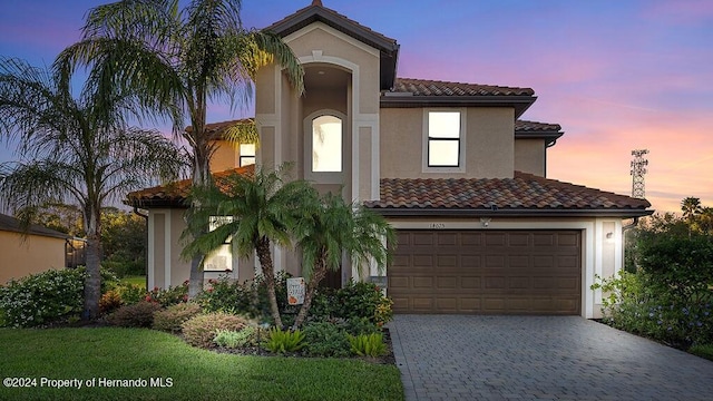 mediterranean / spanish-style house featuring a garage