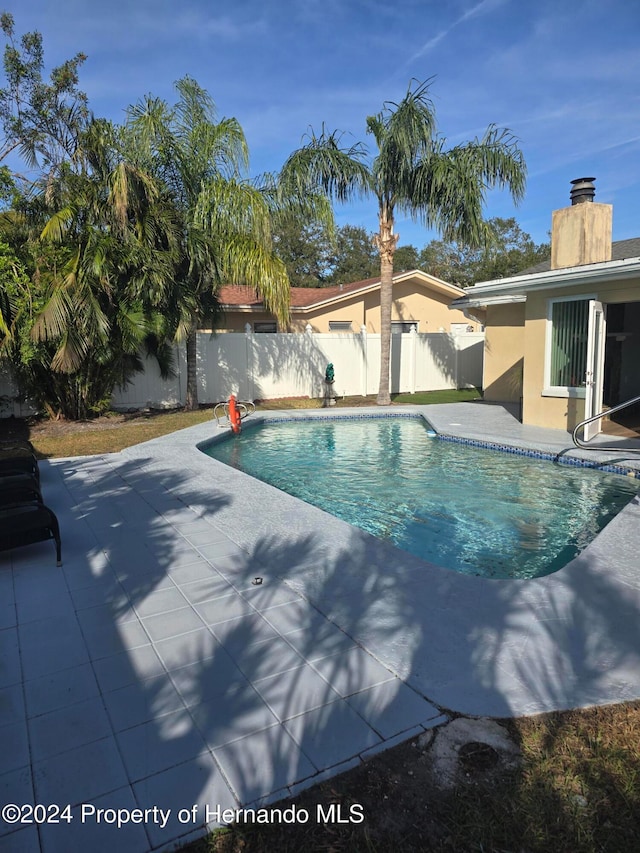 view of pool with a patio