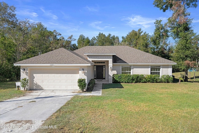 single story home featuring a front yard and a garage