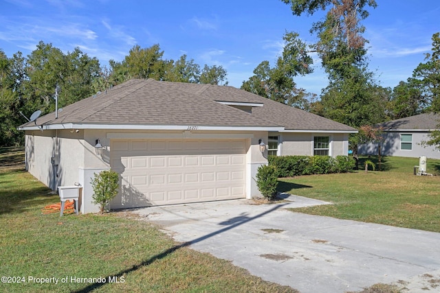 ranch-style house with a garage and a front yard