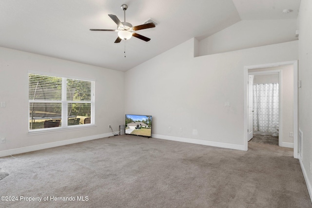 carpeted empty room featuring ceiling fan and lofted ceiling