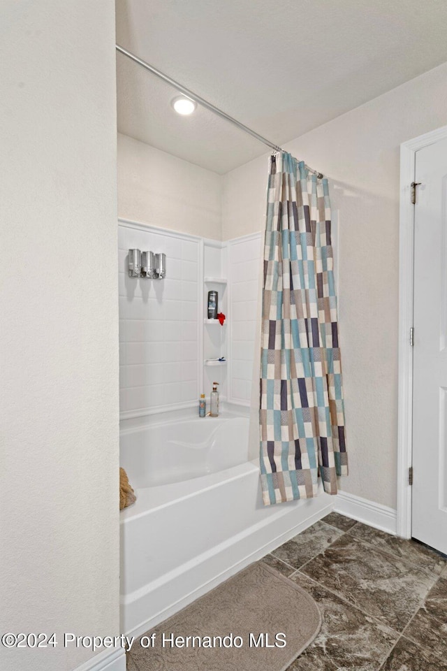 bathroom featuring shower / bath combination with curtain