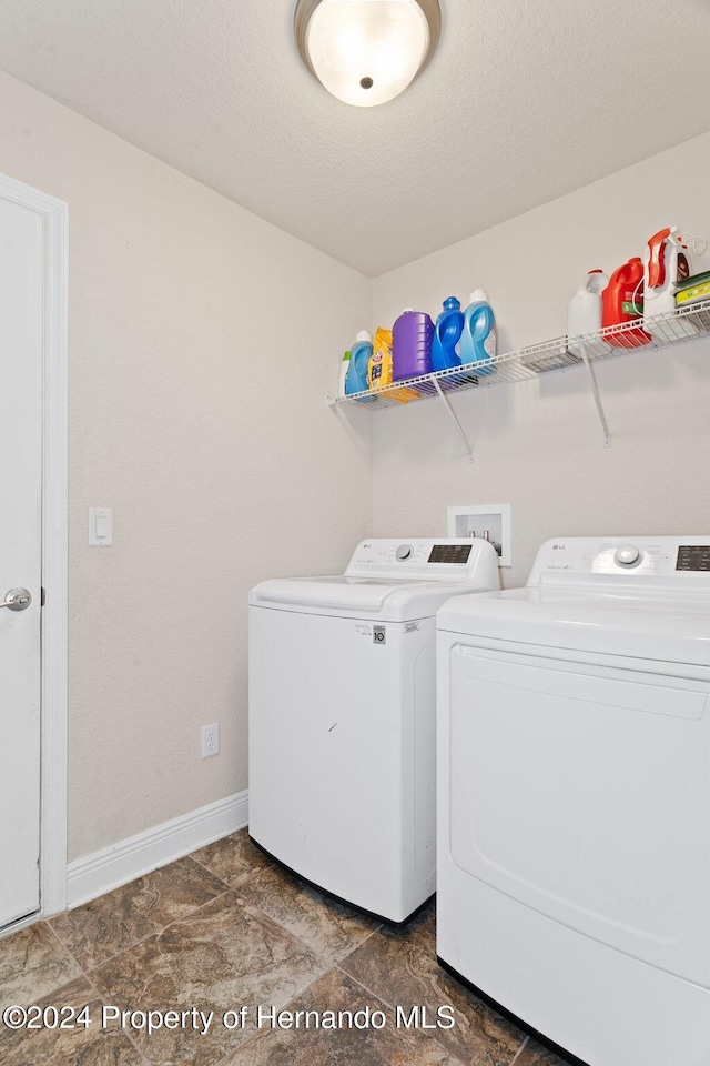 washroom featuring separate washer and dryer